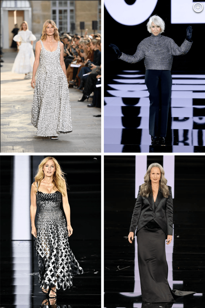 A model walks the runway showcasing a shimmering silver gown in a fashion show setting.